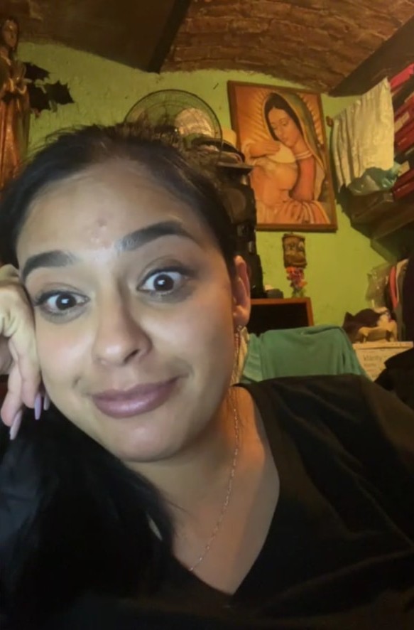 Margarita listening mid-conversation on a video call