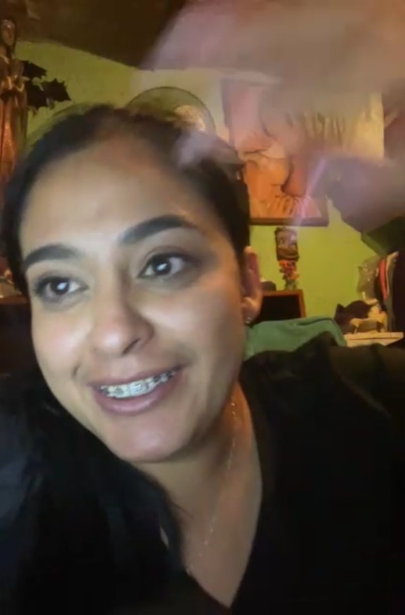 Margarita laughing mid-story on a video call