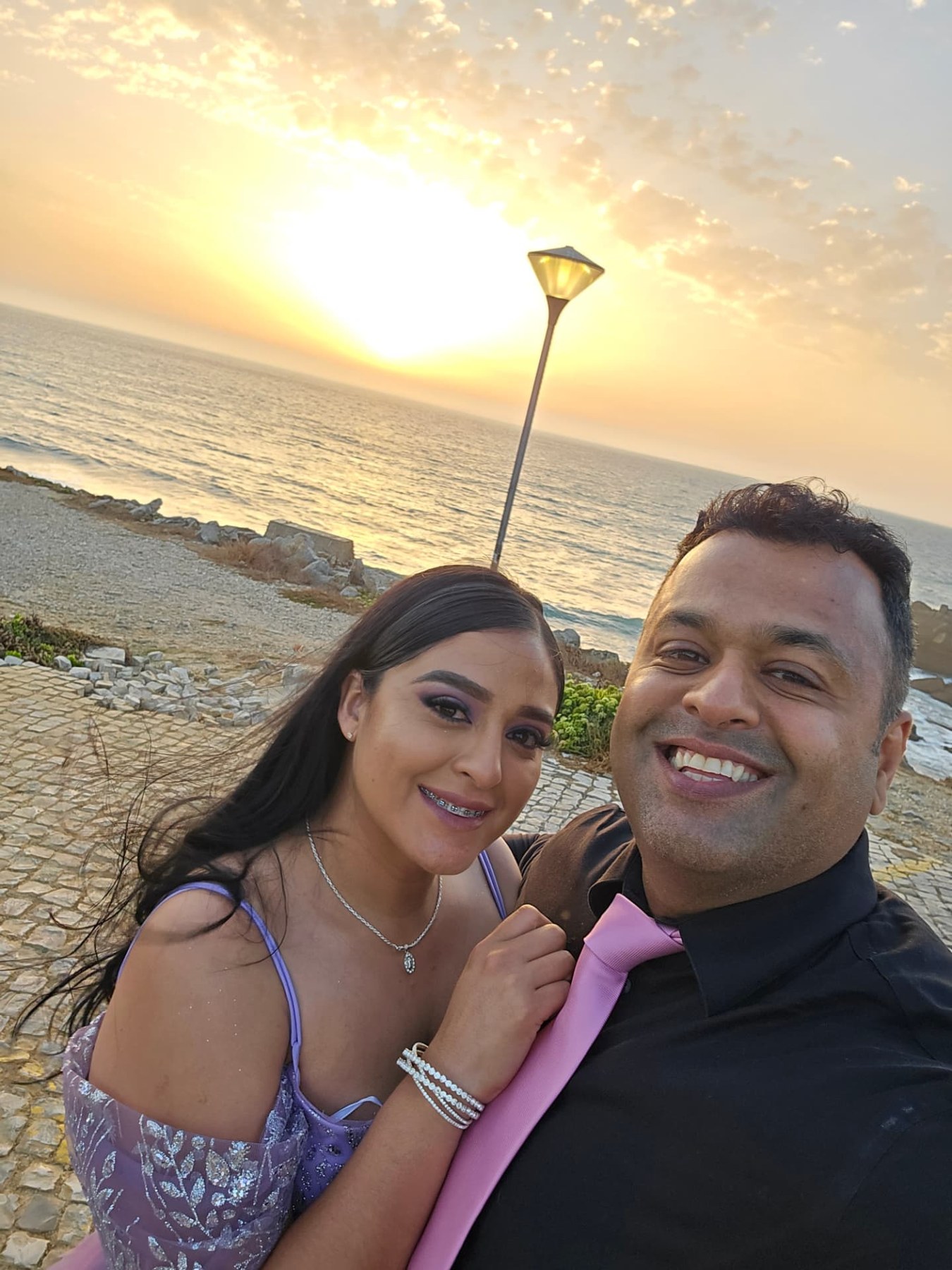 Margarita and Samir together at sunset by the sea
