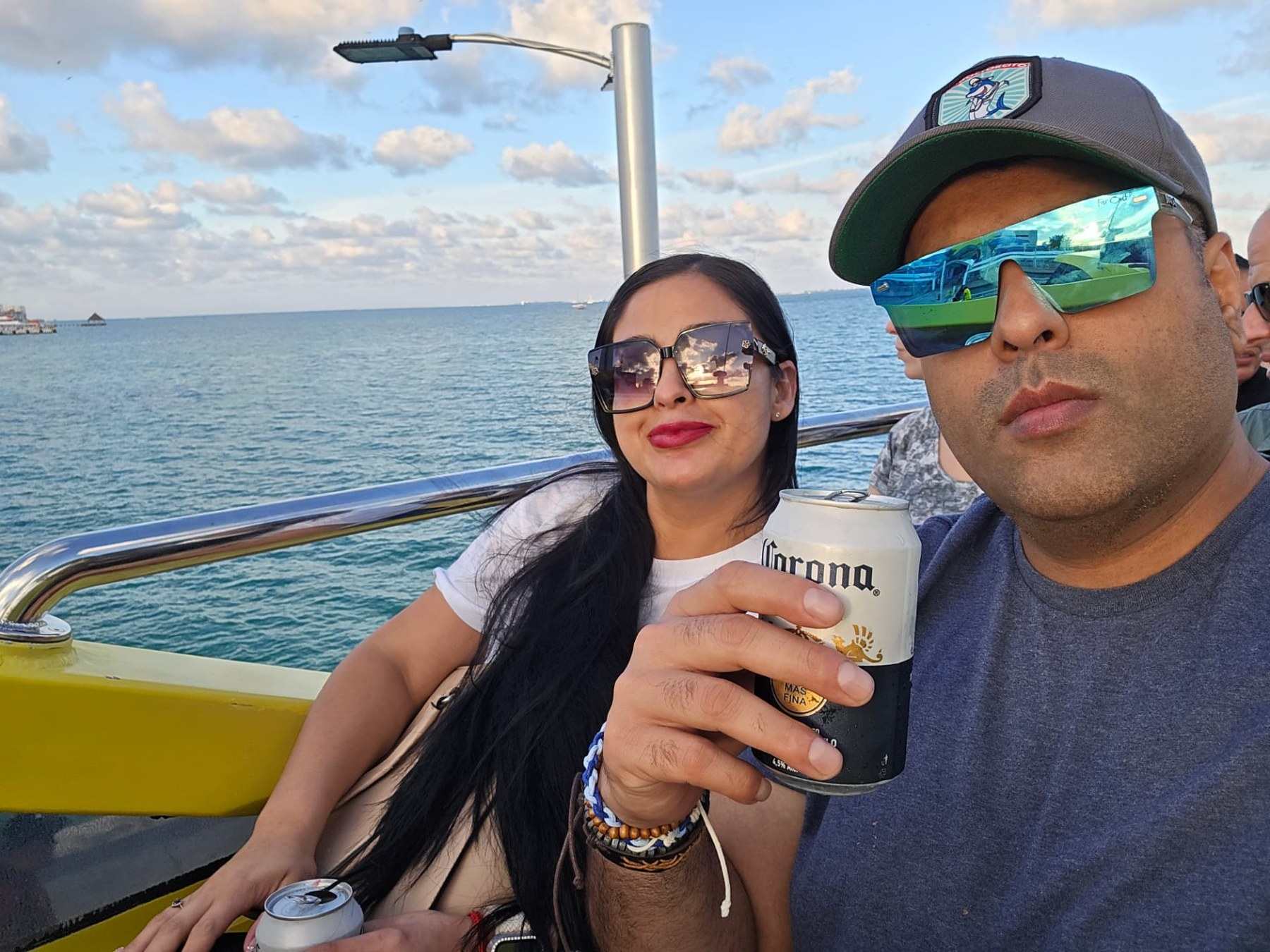 Margarita and Samir enjoying the ocean from a boat