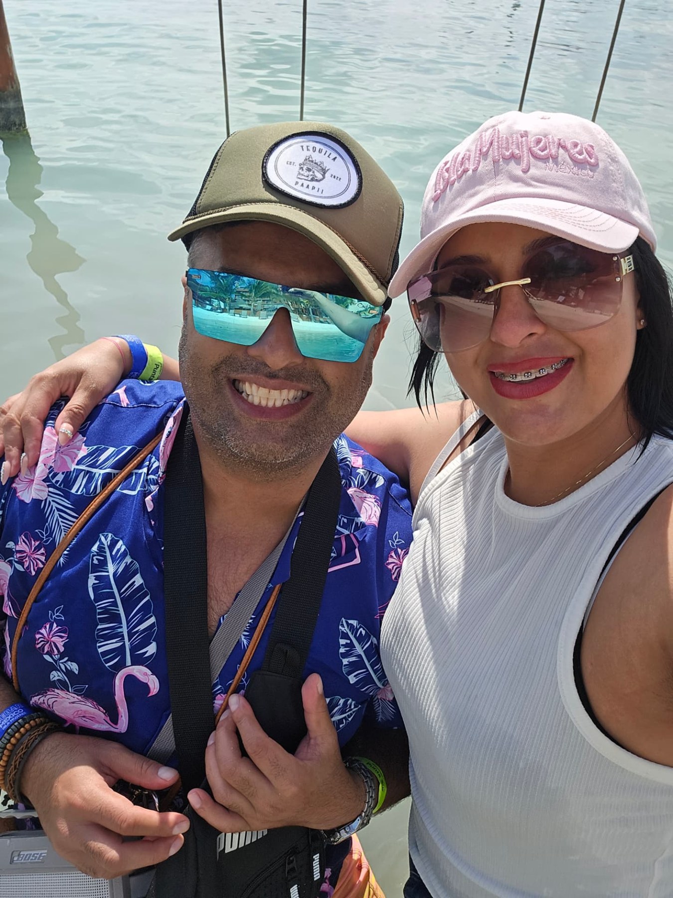 Margarita and Samir smiling by the water
